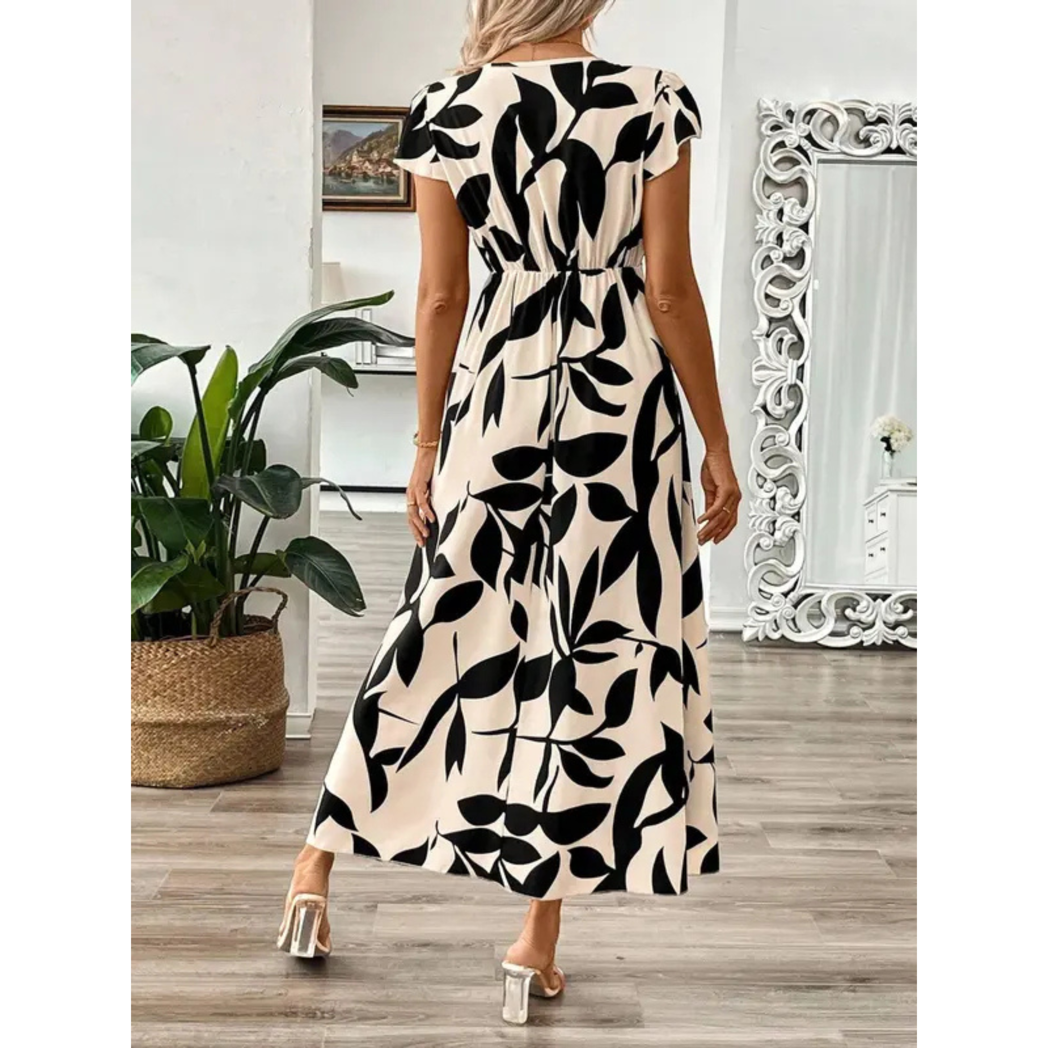 Korevyn - Elegante vloeiende maxi jurk voor dames met zwart en beige bloemenprint