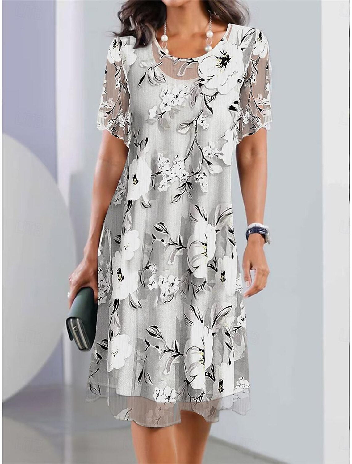 Serenella - geplooide midi-jurk met bloemenprint