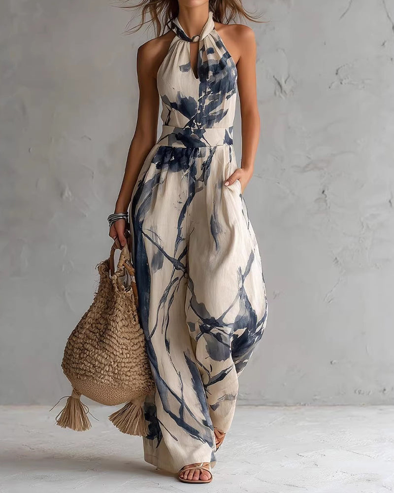 Elvina - Dames jumpsuit met halternek en aquarelprint