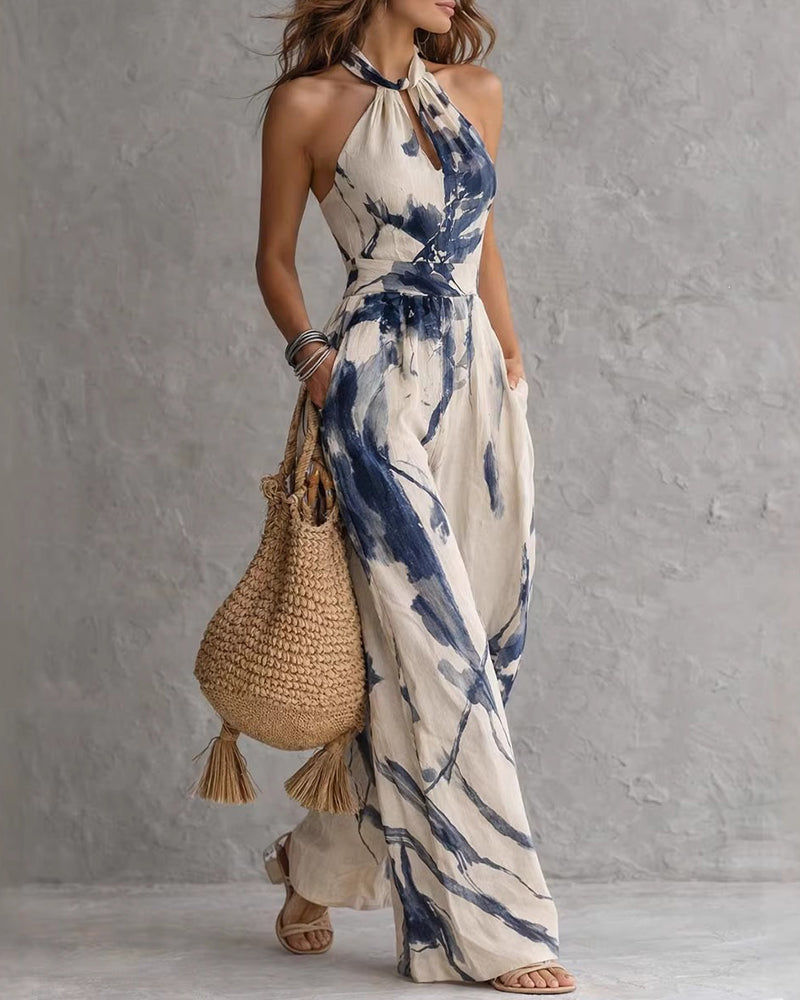 Elvina - Dames jumpsuit met halternek en aquarelprint