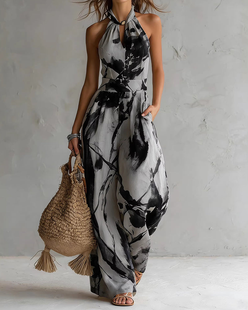 Elvina - Dames jumpsuit met halternek en aquarelprint