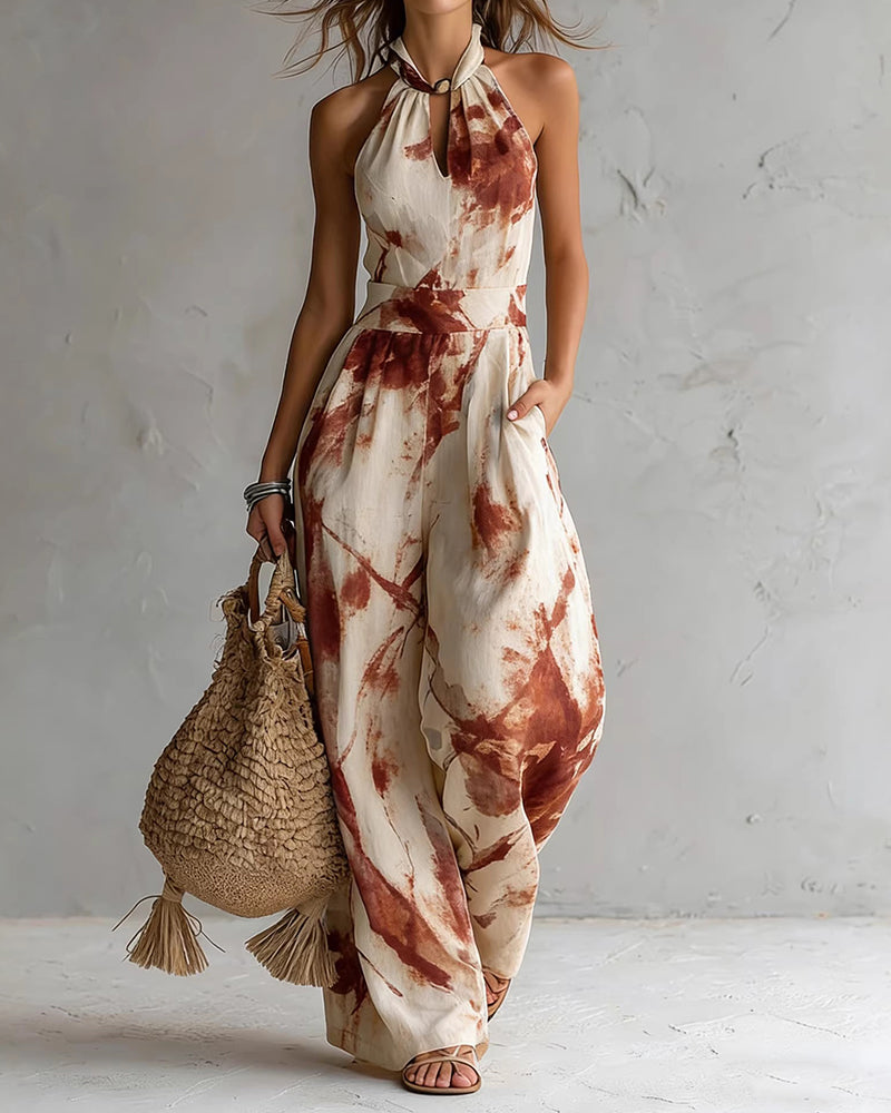 Elvina - Dames jumpsuit met halternek en aquarelprint